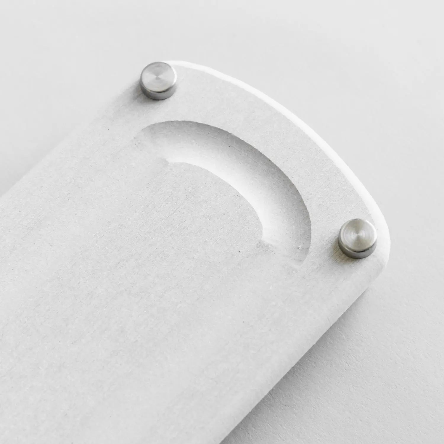 detail of sandstone sink caddy with metal feet