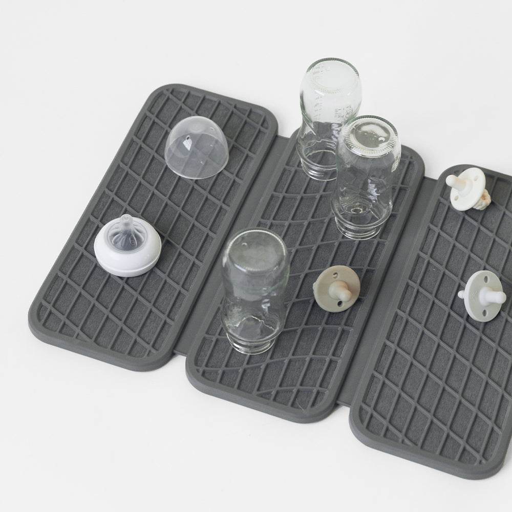 dish drying pad with baby bottles drying