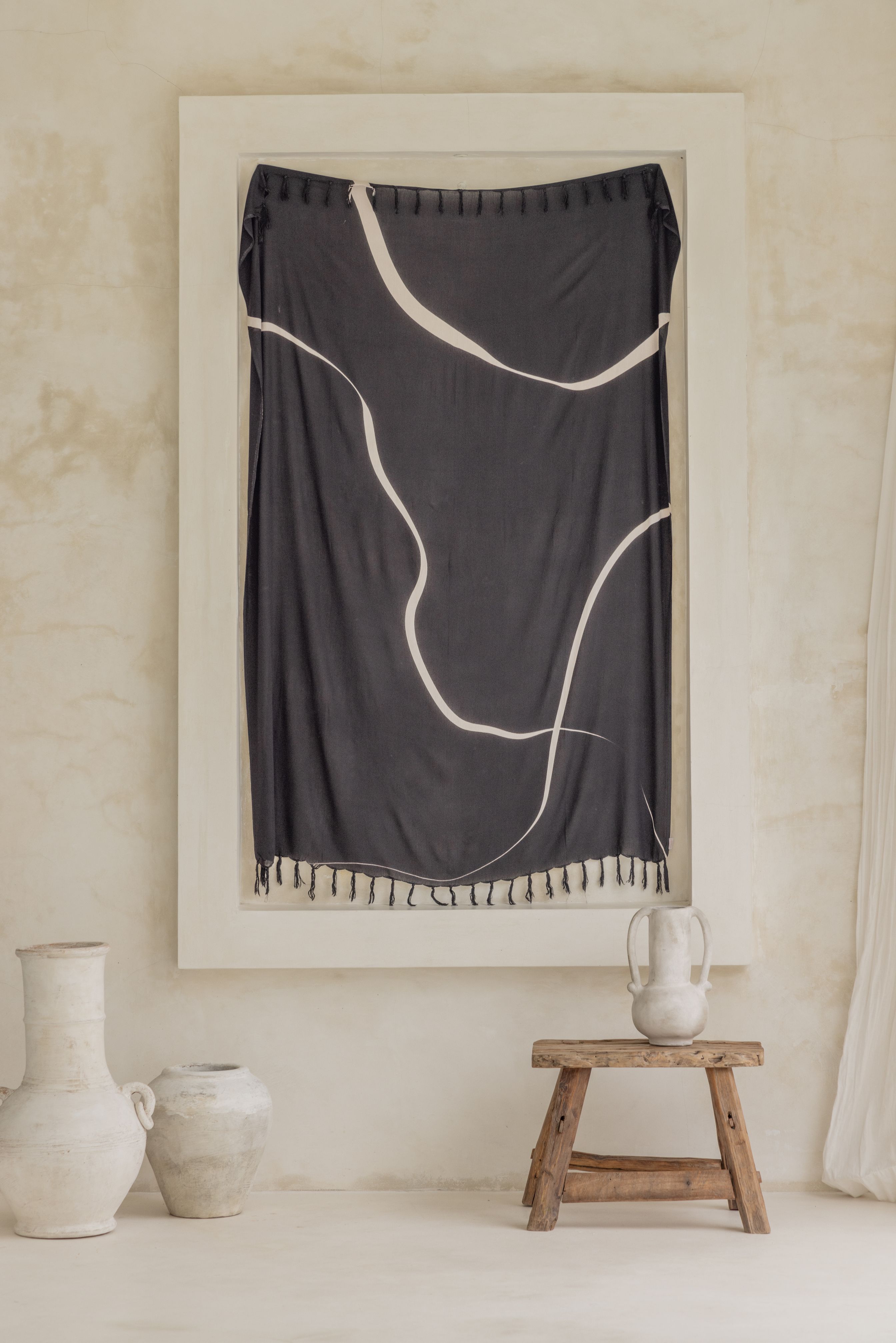Minimalist Tapestry handmade by Village Thrive using natural materials.
