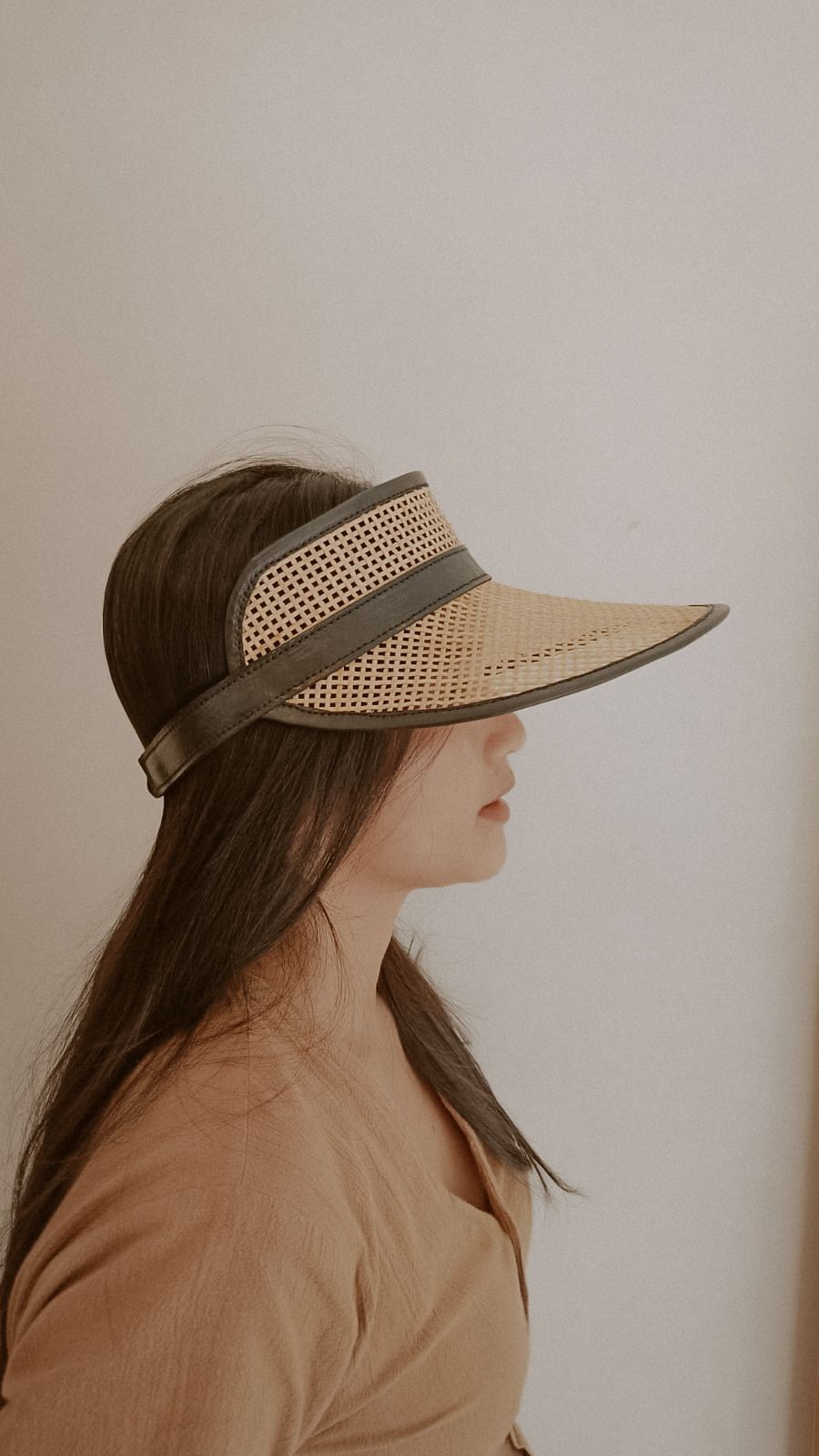 Sumi Leather and Cane Rattan Visor handmade by Village Thrive using natural materials.