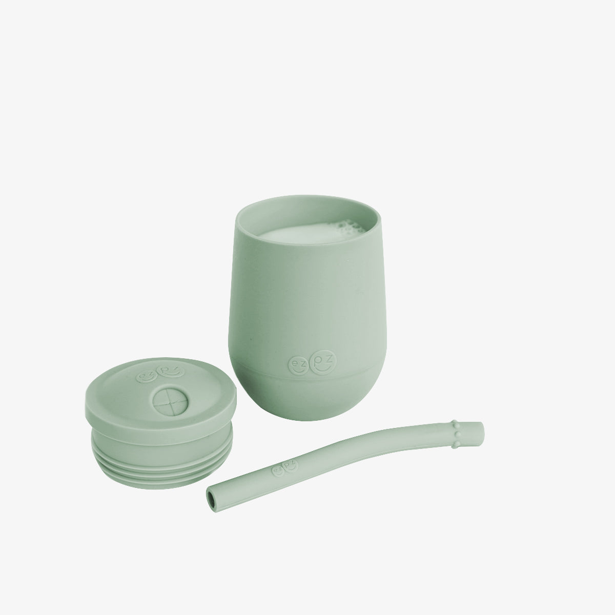 The Mini Cup + Straw in Sage by ezpz / Silicone Drinking Cup and Straw Training System for Toddlers #color_sage
