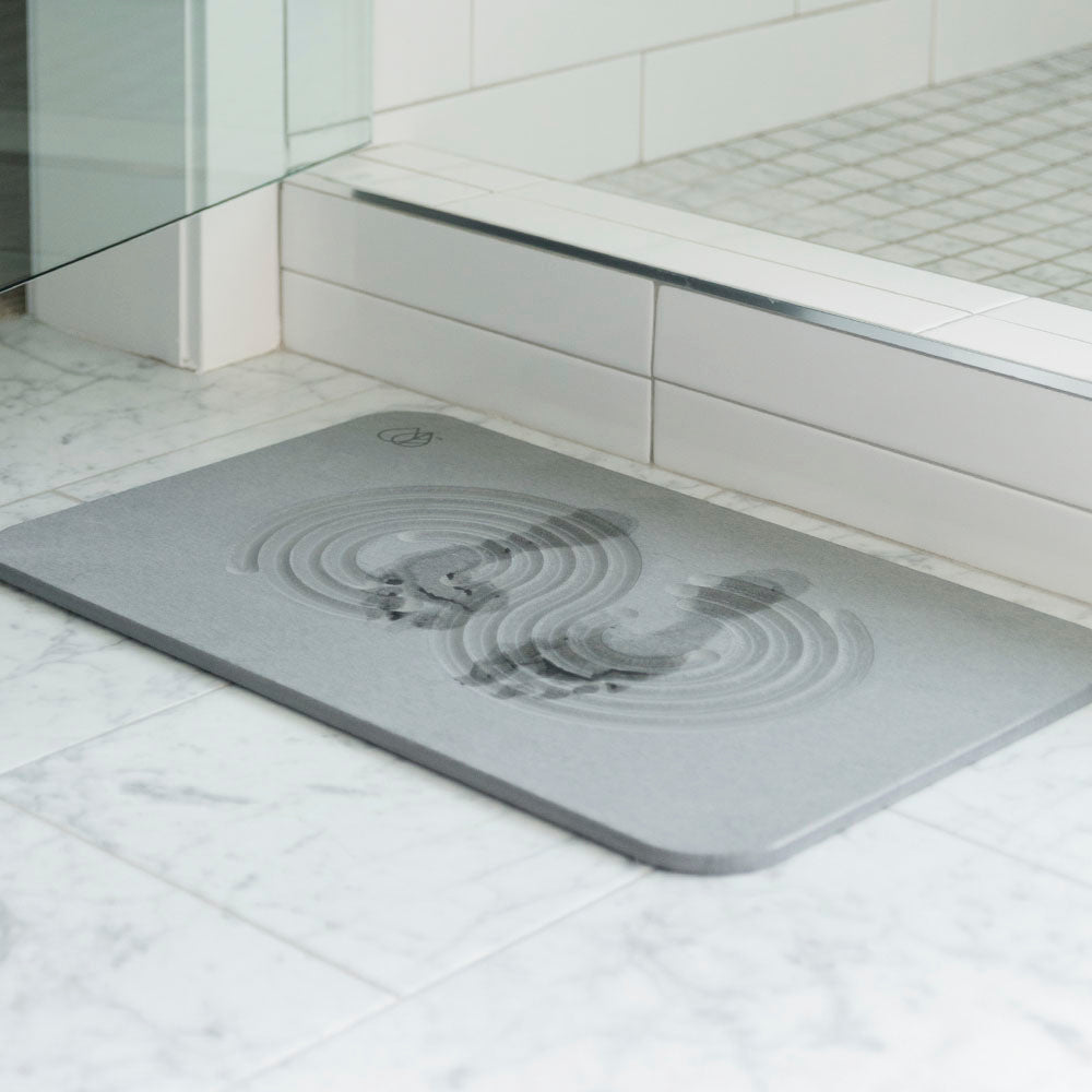 quickly drying foot prints on bath mat 