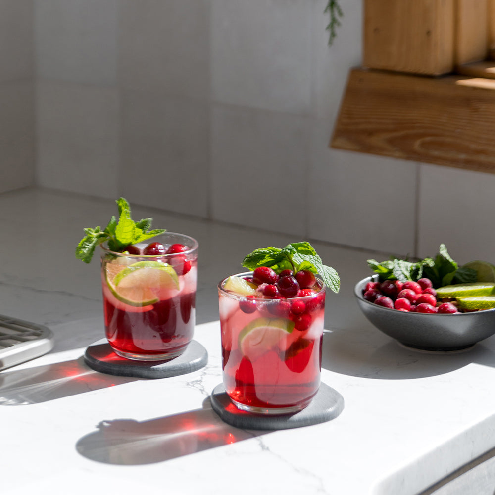 holiday drink on modern stone coasters on kitchen counter