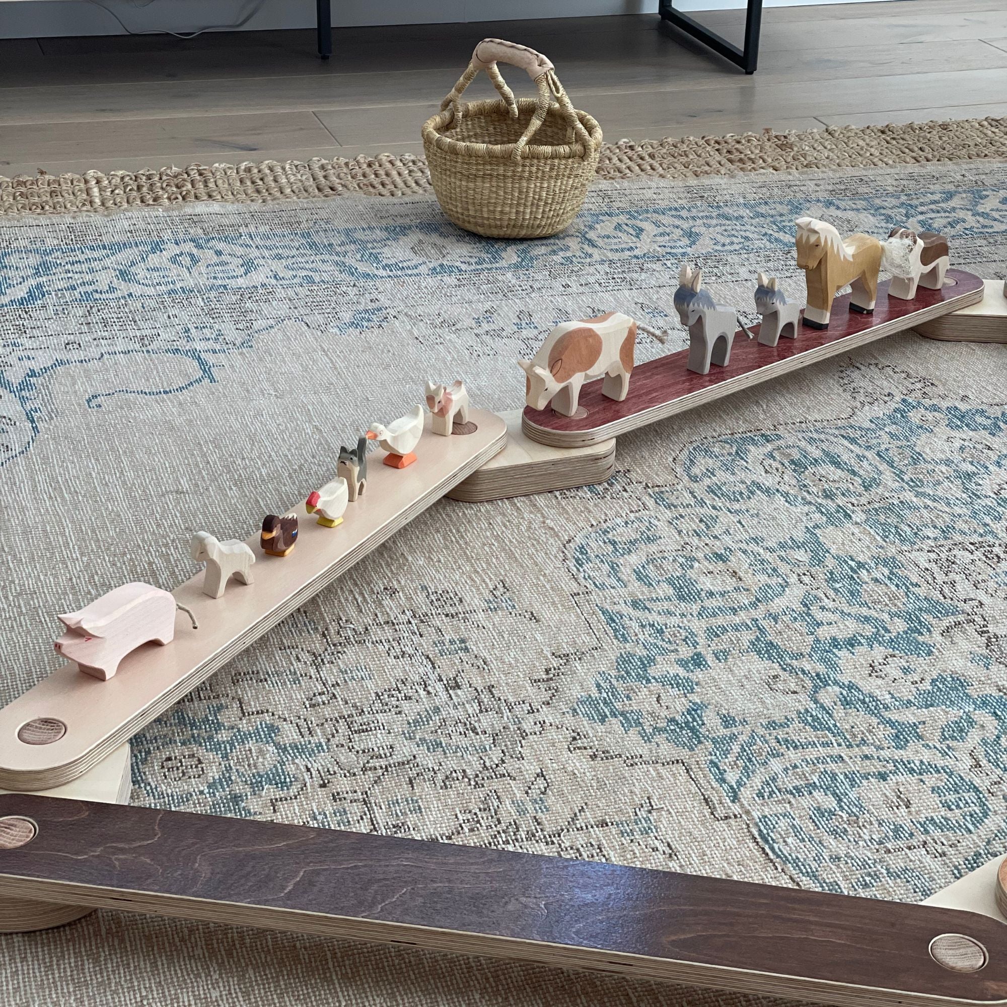 Child using a balance beam indoors