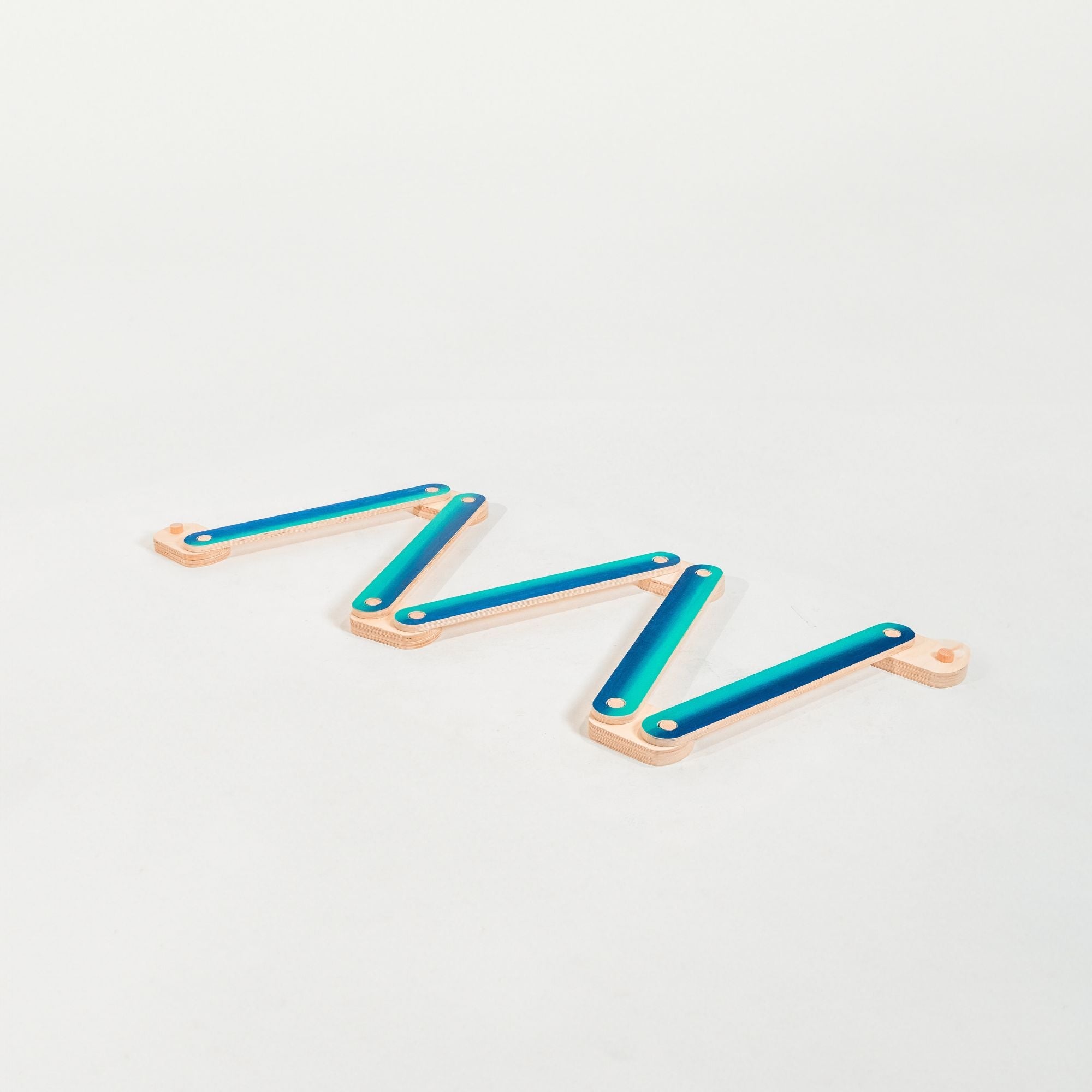 Child practicing motor skills on a beam