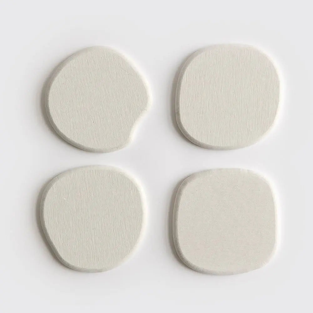4 pack of stone modern coasters in off white color