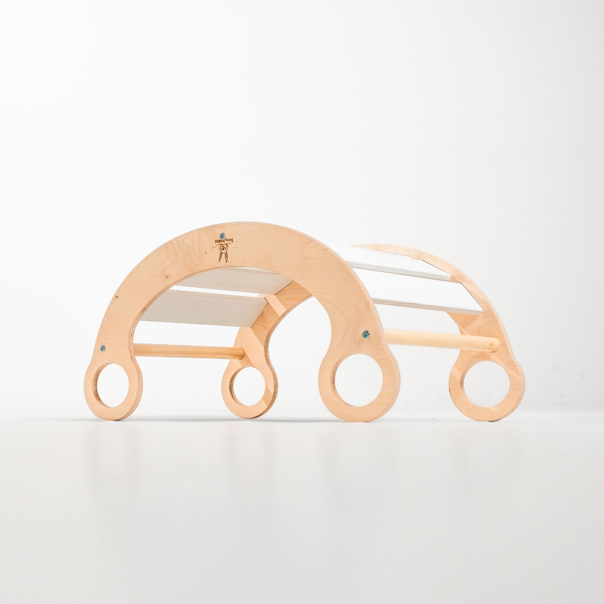 Child enjoying imaginative play with a rocker climber arch