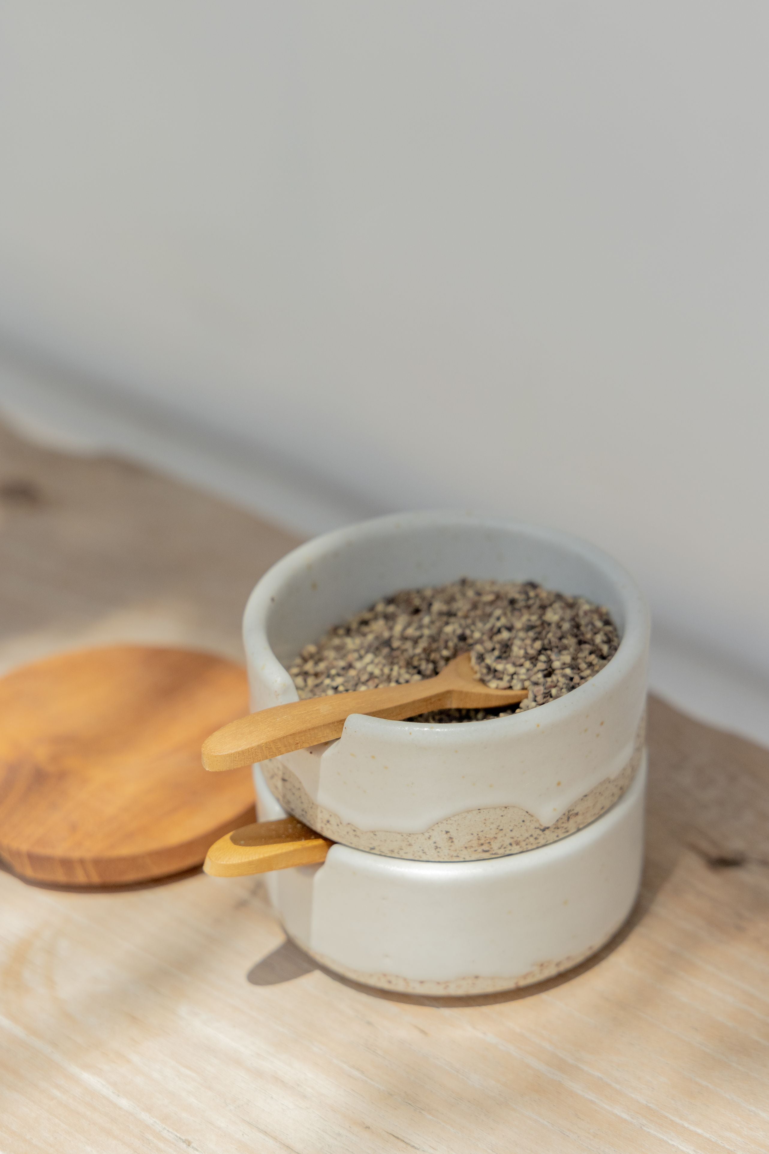 Imperfect Wabi Ceramic Salt & Pepper Holder handmade by Village Thrive using natural materials.