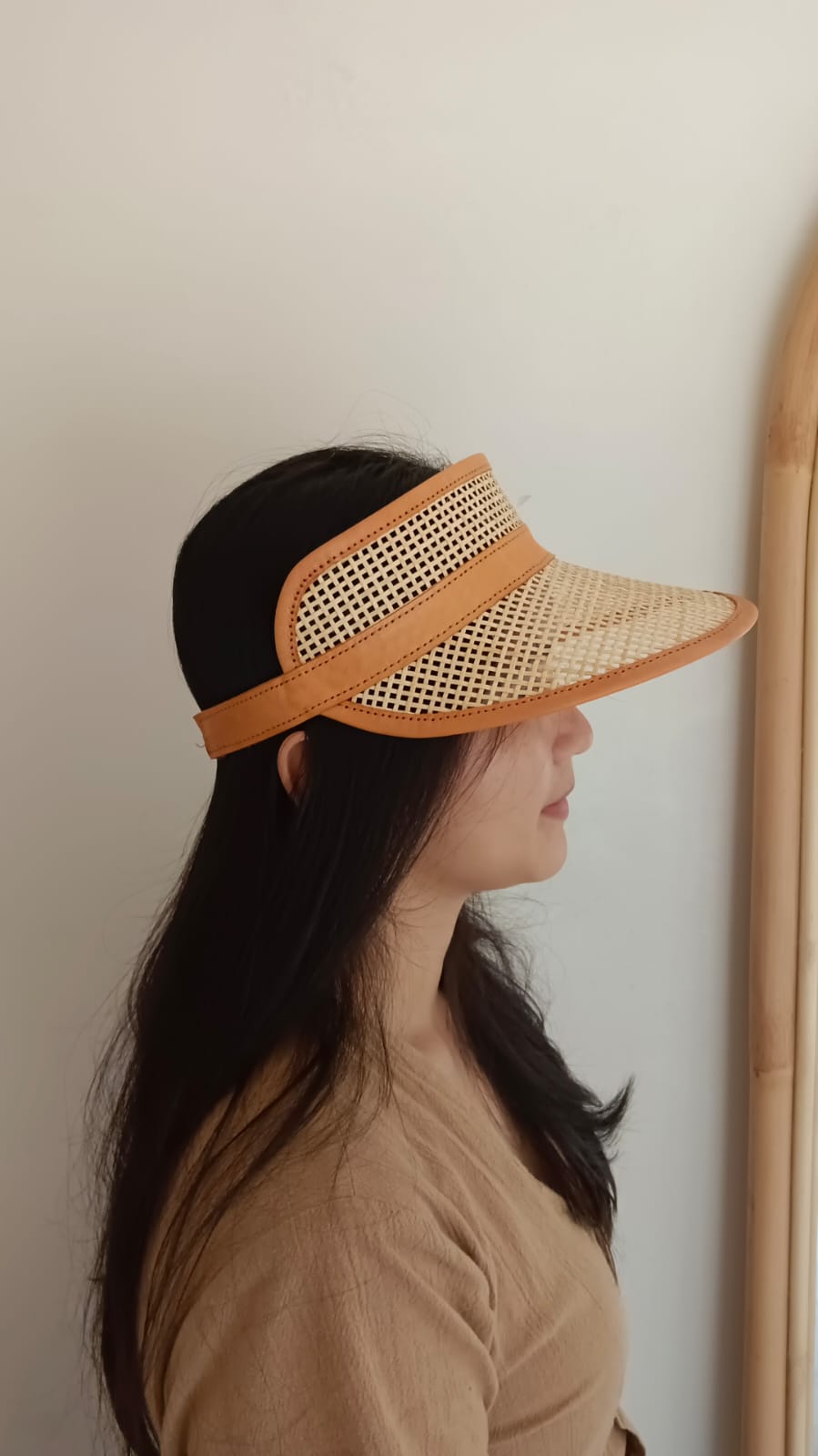 Sumi Leather and Cane Rattan Visor for Kids handmade by Village Thrive using natural materials.