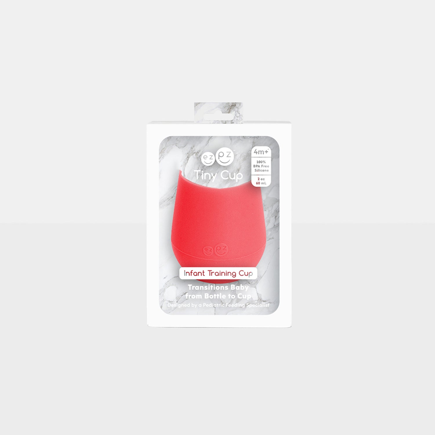 The Tiny Cup in Coral by ezpz / Open-Top, Silicone Drinking Cup for Babies #color_coral