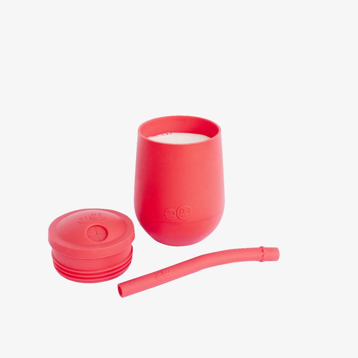 The Mini Cup + Straw in Coral by ezpz / Silicone Drinking Cup and Straw Training System for Toddlers #color_coral