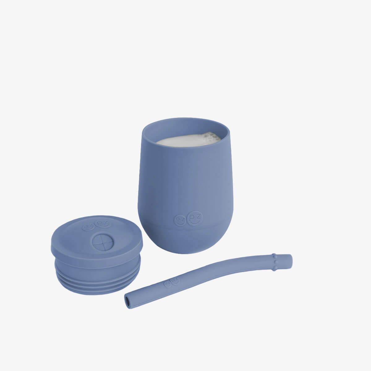 The Mini Cup + Straw in Indigo by ezpz / Silicone Drinking Cup and Straw Training System for Toddlers #color_indigo
